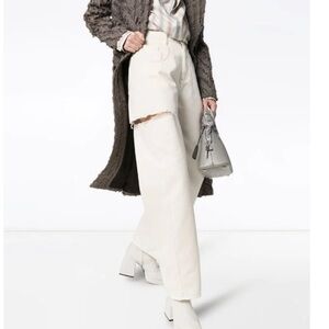 MAISON MARGIELA
Wide-Leg Denim Pants with Slash Details